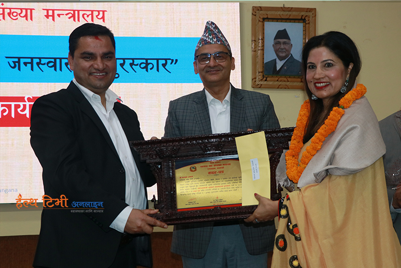 Editor Acharya wins dual awards for media advocacy in public health and gender rights